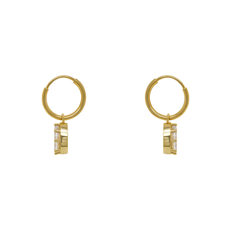 
                  
                    Load image into Gallery viewer, Hoop style earrings made of 14 kt yellow gold vermeil with dangling pear cut crystals each secured with 8 prongs. Displayed side facing on a white background.
                  
                