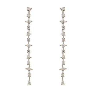 
                  
                    Load image into Gallery viewer, A pair of 925 sterling silver drop earrings with round, pear and marquise cut crystals in front of an ivory colored tile background.
                  
                