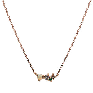 
                  
                    Load image into Gallery viewer, Front view of an asymmetrical cluster necklace set with a cabachon opal, one round emerald and two round diamonds. Set in 14 kt rose gold.
                  
                