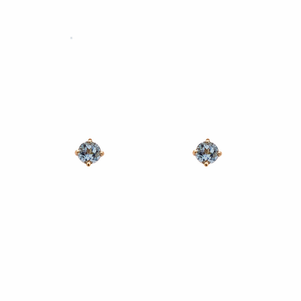 Front view of 3.3 mm round cut, aquamarine studs set in 4 prong 14 kt yellow gold settings. Displayed on a white background.