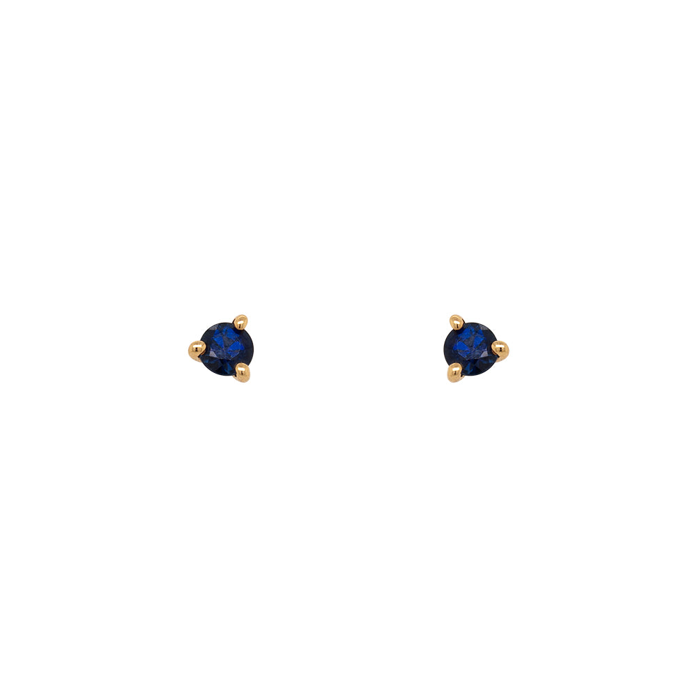 Round Cut Blue Sapphire Studs set in 14 kt yellow gold with three prongs. Displayed on a white background. 