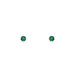 Front view of small, four prong emerald studs set in 14 carat yellow gold. Displayed on a white background.