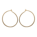 Modern, thin hoop earrings measuring at 24.5 mm.  Made of 925 sterling silver with 14kt yellow gold vermeil.  Displayed side facing on a white background.