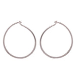 Modern, thin hoop earrings measuring at 24.5 mm. Made of 925 sterling silver. Displayed side facing on a white background.