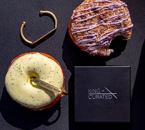 
                  
                    Load image into Gallery viewer, Two brass cuffs and donuts from the  King + Curated and NoFoDoCo collaboration .
                  
                