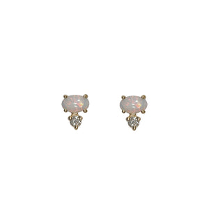 
                  
                    Load image into Gallery viewer, Front view of white oval opals, set east-west in 14 kt yellow gold with 1 round accent diamond set vertically below each. Displayed on white background.
                  
                