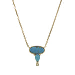 Front view of oval and pear cut turquoise and round diamond necklace cast in 14 kt yellow gold.