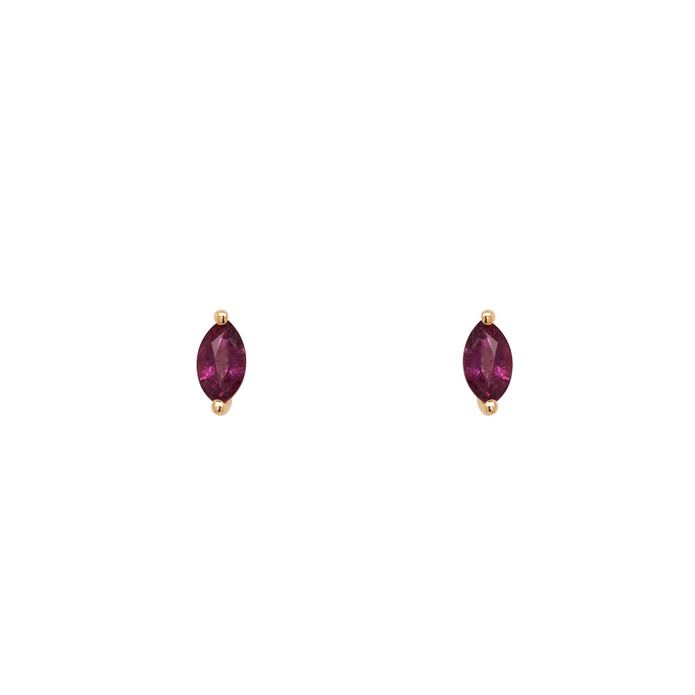 Ruby Studs which are Marquise cut set in 14 kt yellow gold with two prongs. Displayed on a white background.