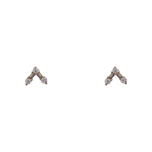 
                  
                    Load image into Gallery viewer, Front view of studs with round and baguette diamonds arranged in V. Set in 14 kt yellow gold. Displayed on white background.
                  
                