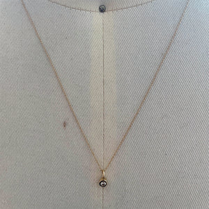 
                  
                    Load image into Gallery viewer, View of bezel set diamond charm on fine gold chain set in 14k yellow gold.
                  
                