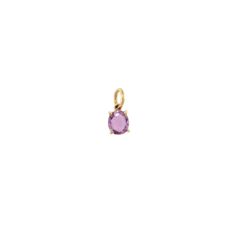 
                  
                    Load image into Gallery viewer, A front view of a purple oval sapphire set in yellow gold shown on a white background.
                  
                