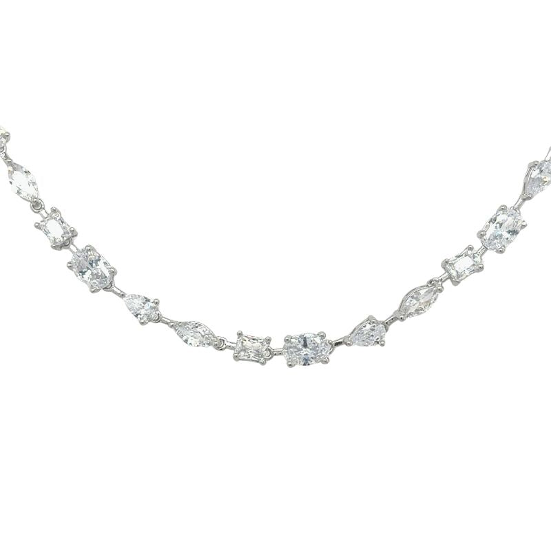 A mixed cut crystal necklace in sterling silver shown on a white background.