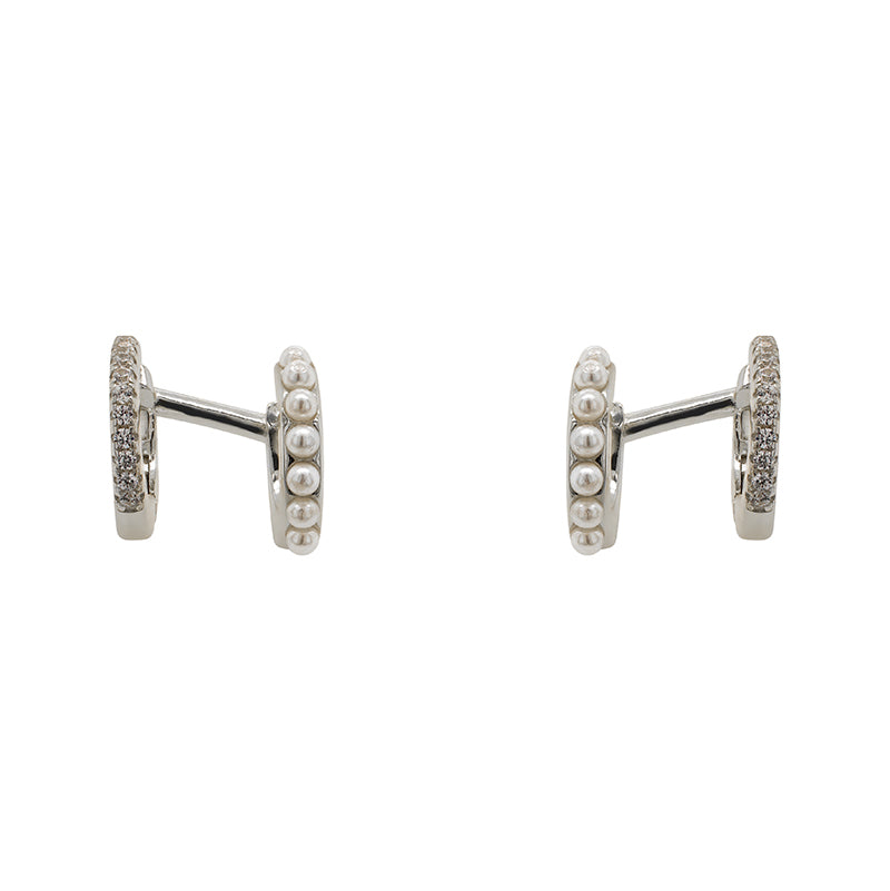 
                  
                    Load image into Gallery viewer, One pair of 925 sterling silver double ear hugger ear cuffs. Adorned with pearls on one side and crystals on the other. Displayed front facing on a marble background.
                  
                