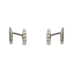 
                  
                    Load image into Gallery viewer, One pair of 925 sterling silver double ear hugger ear cuffs. Adorned with pearls on one side and crystals on the other. Displayed front facing on a marble background.
                  
                