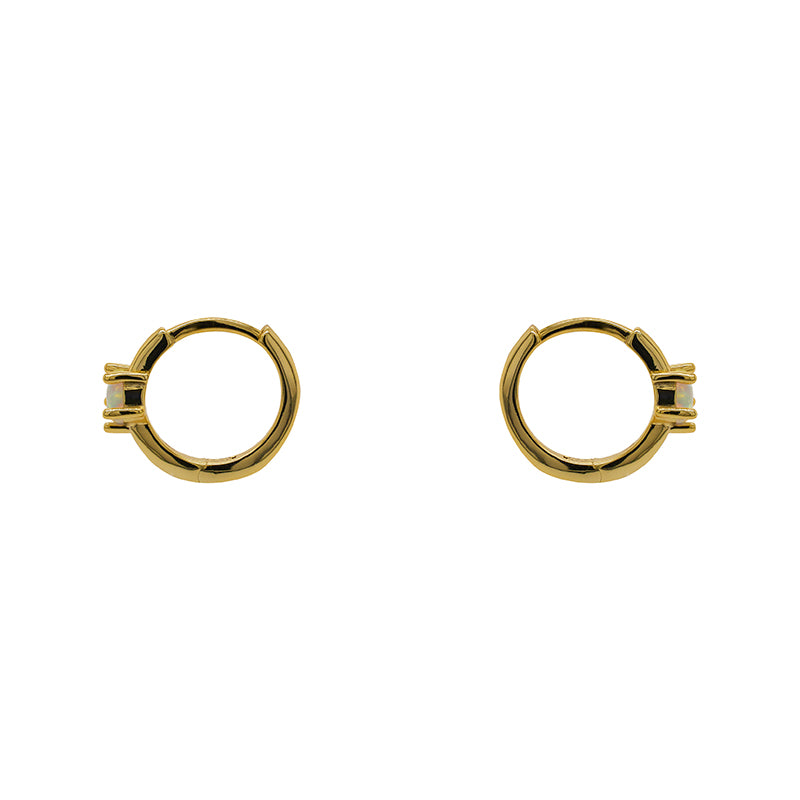 
                  
                    Load image into Gallery viewer, 14 kt yellow gold vermeil huggie style earrings with faux opals set with 5 prongs. Displayed side facing on a white background.
                  
                