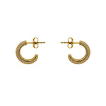 These earring are made in sterling silver with 14kt gold plating and 5 rows of pave-set crystals. This hoops are 14mm wide and 3.1mm thick. Displayed side facing on a marbled background.
