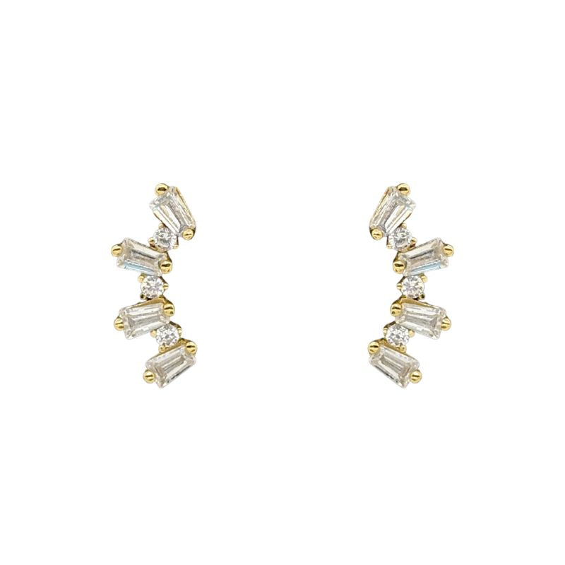 A pair of yellow gold studs with baguette and round cut crystals shown on a white background.