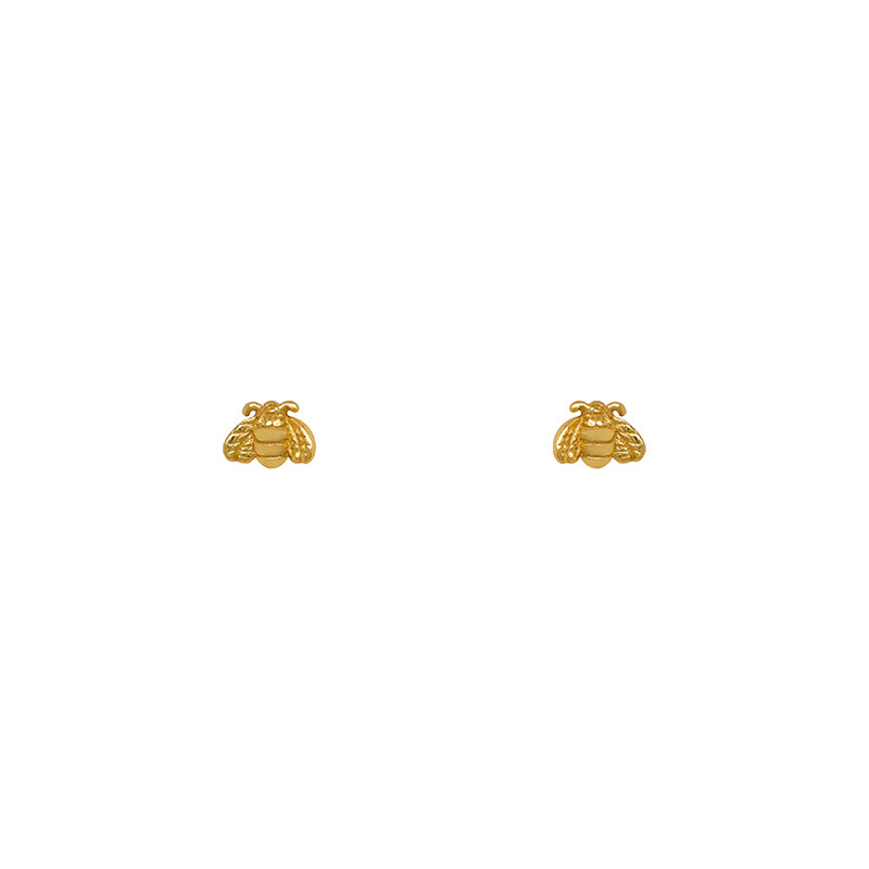 Tiny bee shaped earring studs made of 14 kt yellow gold vermeil.
