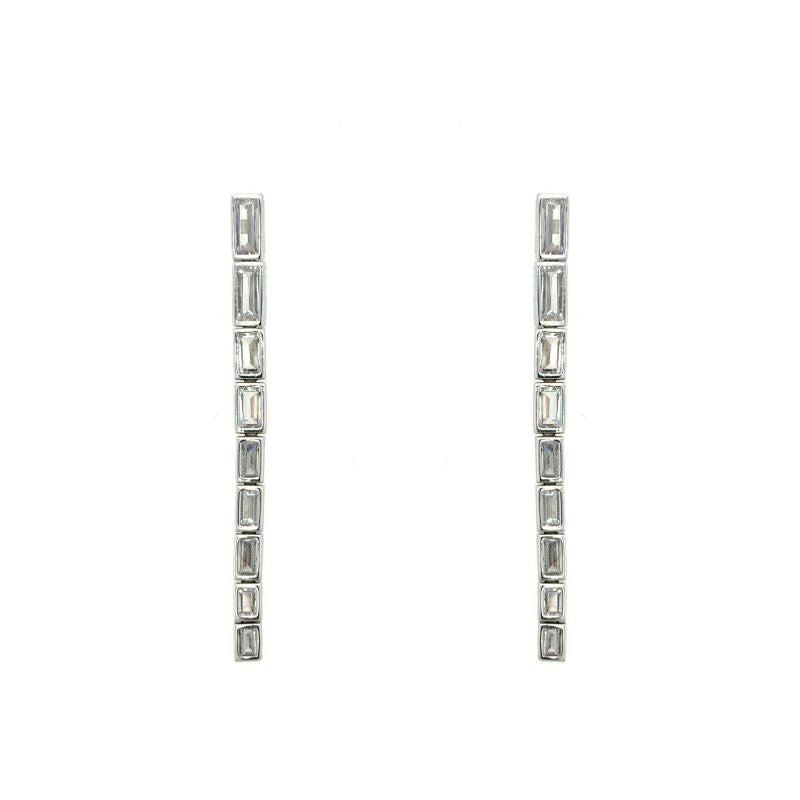 A pair of sterling silver drop earrings with bezel set graduated baguette crystals. Shown on a white background.