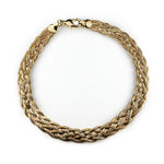 Overview of a gold filled braided link style anklet on a white background.