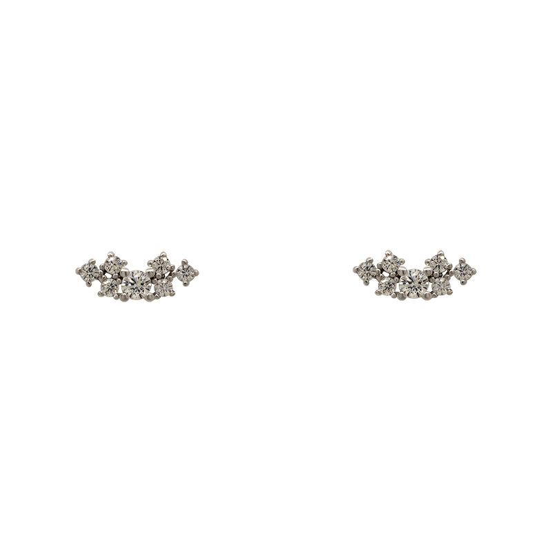 Pair of earrings with 7 round crystals in varied sizes clustered in a row. Settings are made of 925 sterling silver.