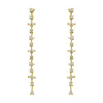 A pair of 14 kt yellow gold vermeil drop earrings with round, pear and marquise cut crystals in front of an ivory colored tile background.