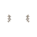 A pair of crystal cluster studs with 2 round cut and 3 baguette cut crystals set in 925 sterling silver settings on a white background.
