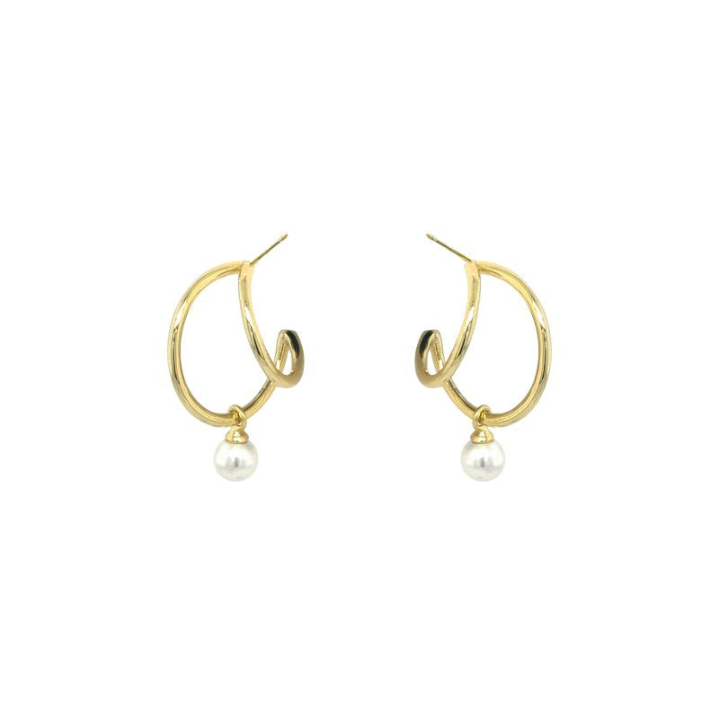 A front view of yellow gold hoops with a hanging pearl shown on a white background.