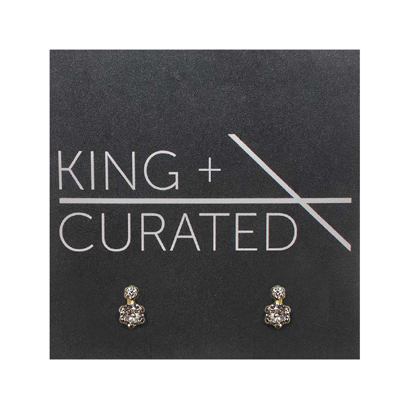 Vertical double crystal studs with 6 prongs each. Made of sterling silver with a 14 kt yellow gold plating.