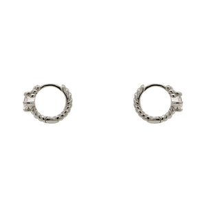 
                  
                    Load image into Gallery viewer, A pair of twist pattern style huggie earrings with princess cut crystals made of sterling silver. Displayed side facing on a white background.
                  
                