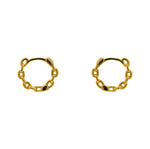 A pair of hinged huggie hoops with chain pattern cast in sterling silver with a 14kt yellow gold plating. Displayed side facing on a marble background.