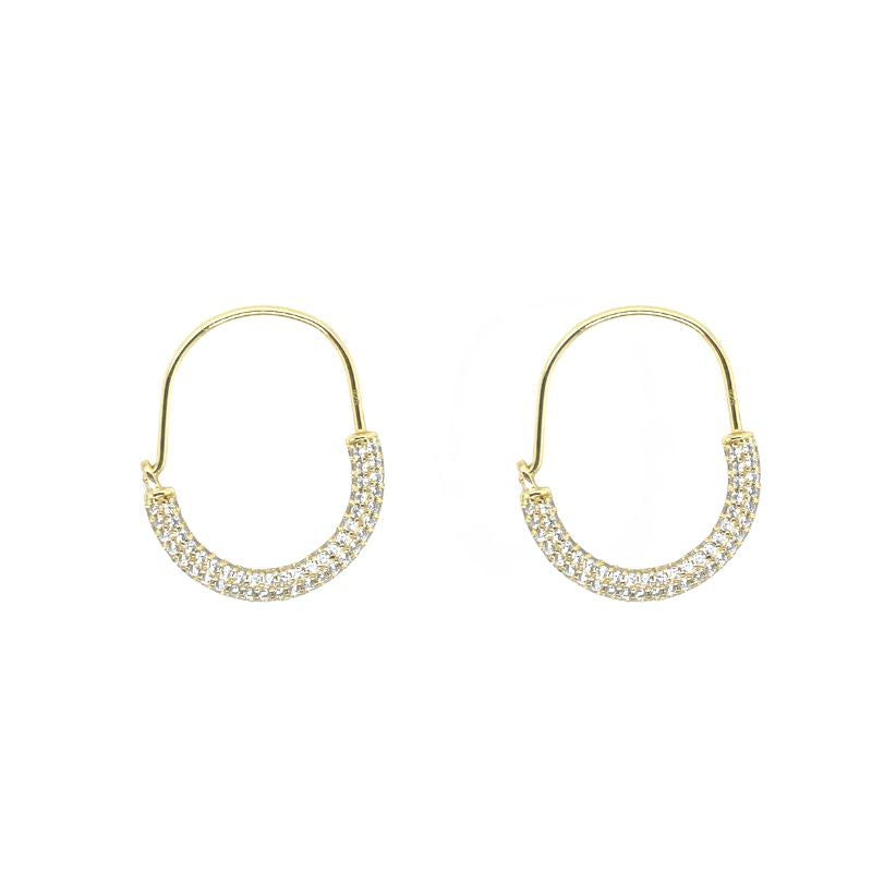 These hoop earrings with micro pave crystals on half of the hoop are available 14 kt yellow gold vermeil.
