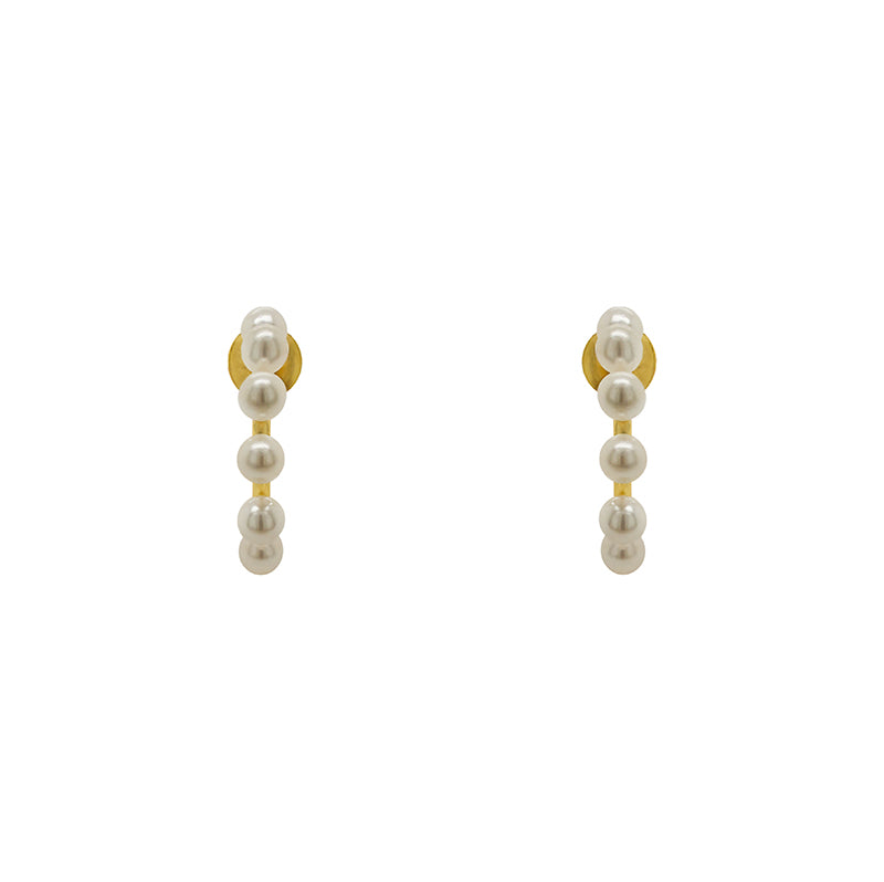 These 3/4 wire hoop earrings are made of 925 sterling silver with 14kt yellow gold vermeil. Each hoop is adorned with 8 pearls and measure at 17.25 mm. Displayed front facing on a marble background.