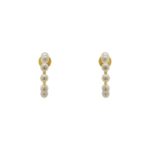 
                  
                    Load image into Gallery viewer, These 3/4 wire hoop earrings are made of 925 sterling silver with 14kt yellow gold vermeil. Each hoop is adorned with 8 pearls and measure at 17.25 mm. Displayed front facing on a marble background.
                  
                