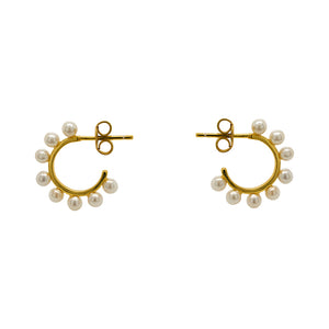 
                  
                    Load image into Gallery viewer, These 3/4 wire hoop earrings are made of 925 sterling silver with 14kt yellow gold vermeil. Each hoop is adorned with 8 pearls and measure at 17.25 mm. Displayed side facing on a marble background.
                  
                