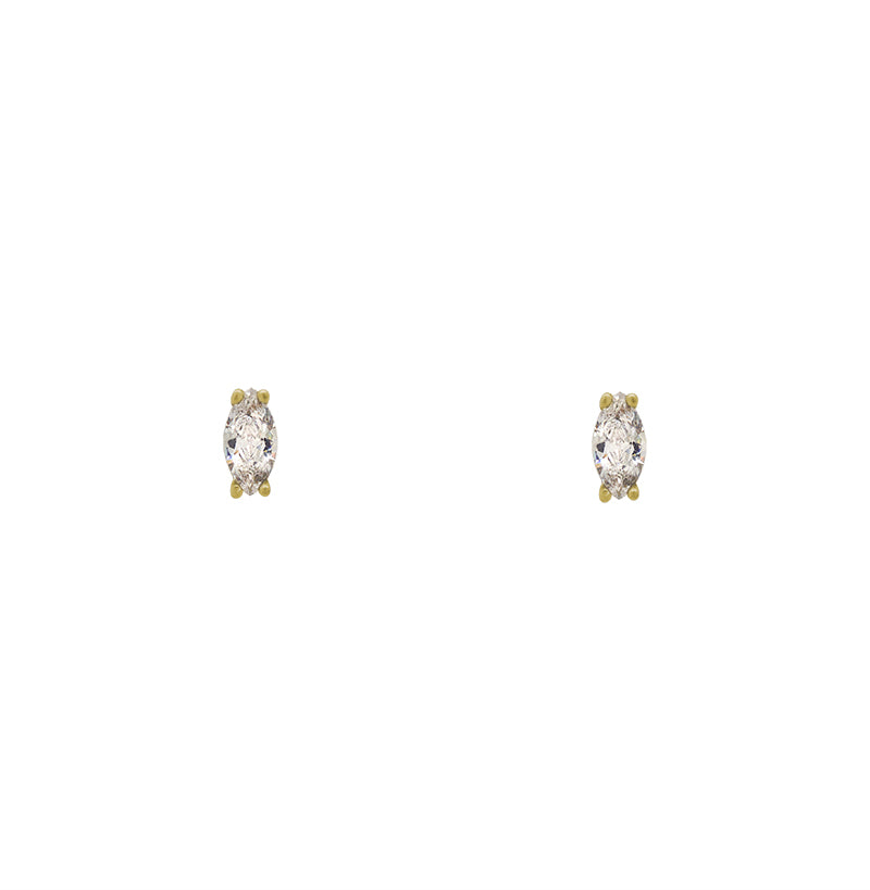 A pair of marquise cut crystal studs set in a 14 kt yellow gold vermeil, four prong setting on a white background.