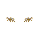 A pair of 14 kt yellow gold vermeil cluster studs with 4 round and 7 baguette crystals on each stud, and on a white backgtround.