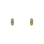 A pair of 14 kt yellow gold vermeil, hexagonal shaped studs with round and baguette cut AAA crystals on a white background.