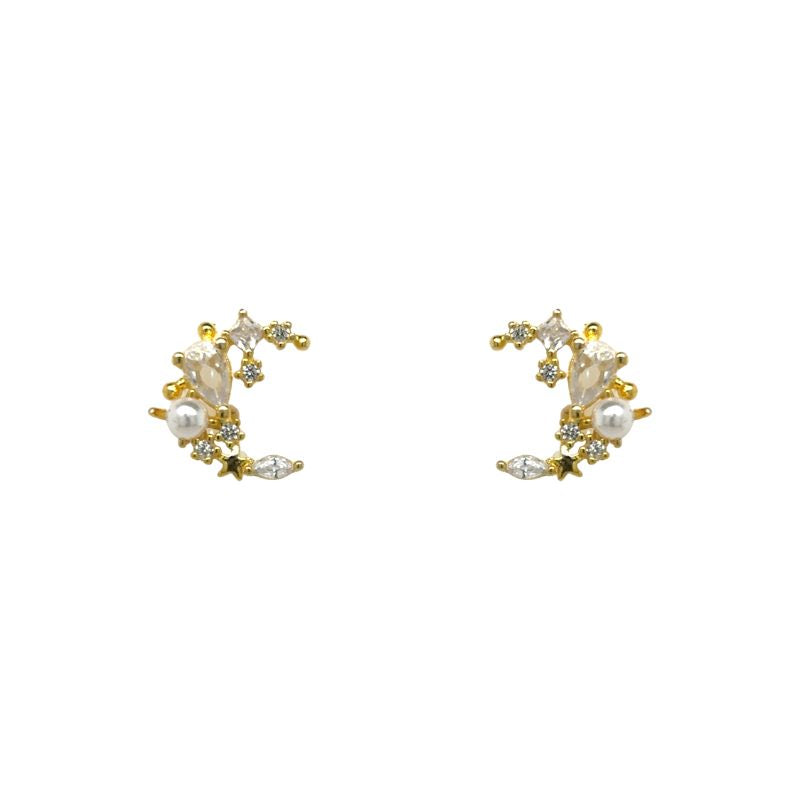 Tiny half-moon studs with a mix of pear, round, and marquise crystals clusters and petite pearls. Shown on a white background.