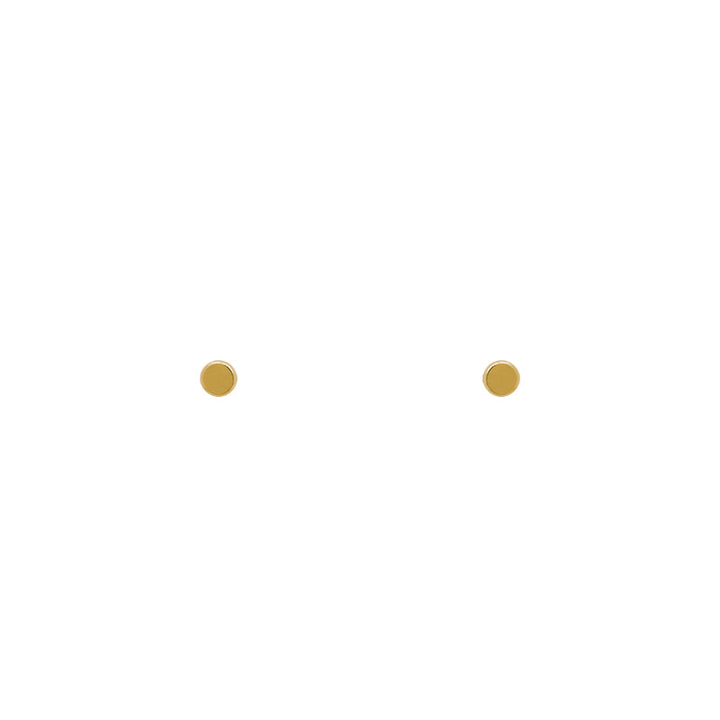 A pair of tiny, round shaped stud earrings made of 14 kt yellow gold vermeil, and on a white background.
