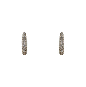 
                  
                    Load image into Gallery viewer, Huggie style earrings made of sterling silver and completely encrusted with tiny, 1 mm crystals. Displayed forward facing on a white background.
                  
                