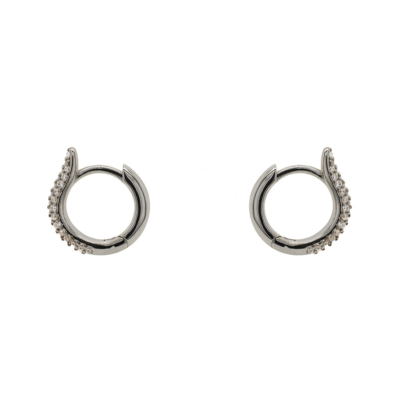 
                  
                    Load image into Gallery viewer, Huggie style earrings made of sterling silver and completely encrusted with tiny, 1 mm crystals. Displayed side facing on a white background.
                  
                