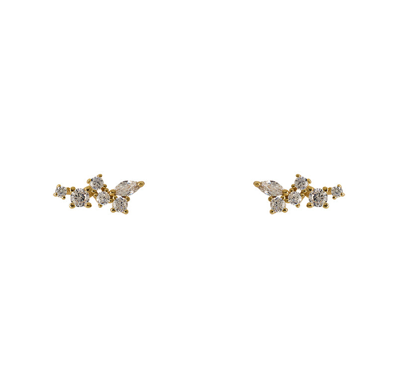 Crystal cluster studs with sterling silver settings with a 14 kt yellow gold plating. Each stud has 5 rounds crystals and one marquise cut crystal.