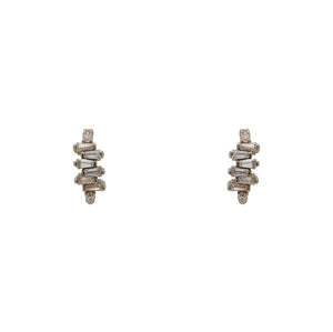
                  
                    Load image into Gallery viewer, A pair of huggie style earrings made of sterling silver with tapered baguette crystals. Displayed forward facing on a white background.
                  
                