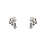 A pair of pear cut crystal studs, each having 3 small bezel set crystals, 2 rounds and 1 pear, dangling below and made of 925 sterling silver.