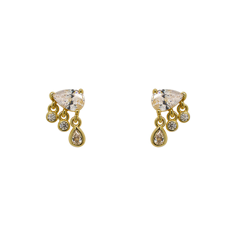 A pair of pear cut crystal studs, each having 3 small bezel set crystals, 2 rounds and 1 pear, dangling below and made of 14 kt yellow gold vermeil.