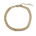 Overview of a gold filled link style anklet on a white background.