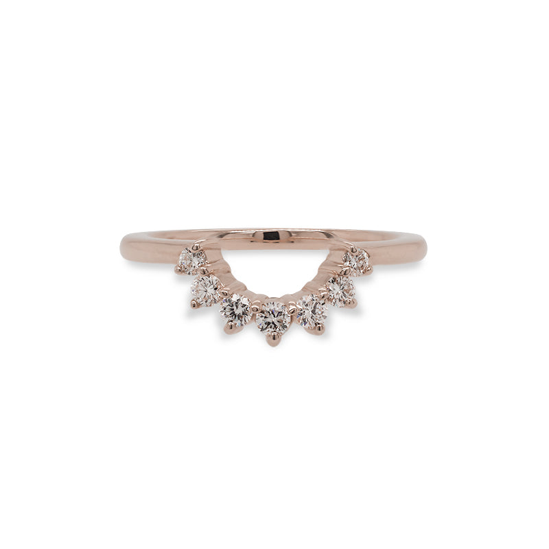 
                  
                    Load image into Gallery viewer, Front view of a diamond shadow band made of solid 14 kt rose gold with 7 round cut diamonds that follow along the center dip in the band.
                  
                