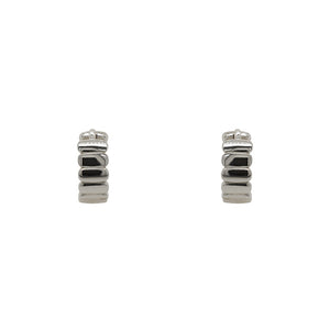 
                  
                    Load image into Gallery viewer, Pair of hinged huggie earrings with a flat organic texture. 4.6mm wide and made of sterling silver. Displayed forward facing on a white background.
                  
                