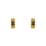 Pair of hinged huggie earrings with a flat organic texture. 4.6mm wide and made of sterling silver with a 14kt yellow gold plating. Displayed forward facing on a white background.